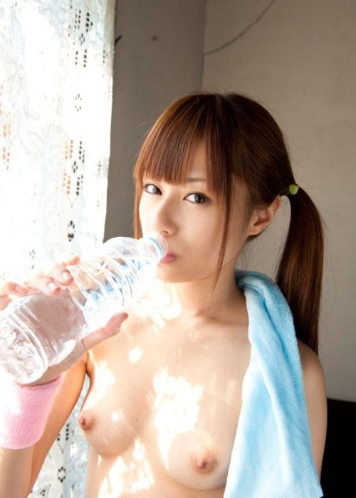 athletic chinese girl with boobs out sipping from water bottle